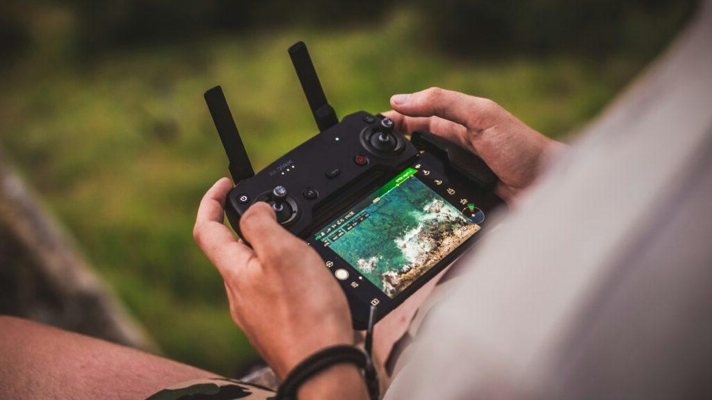 A man remotely operating a drone